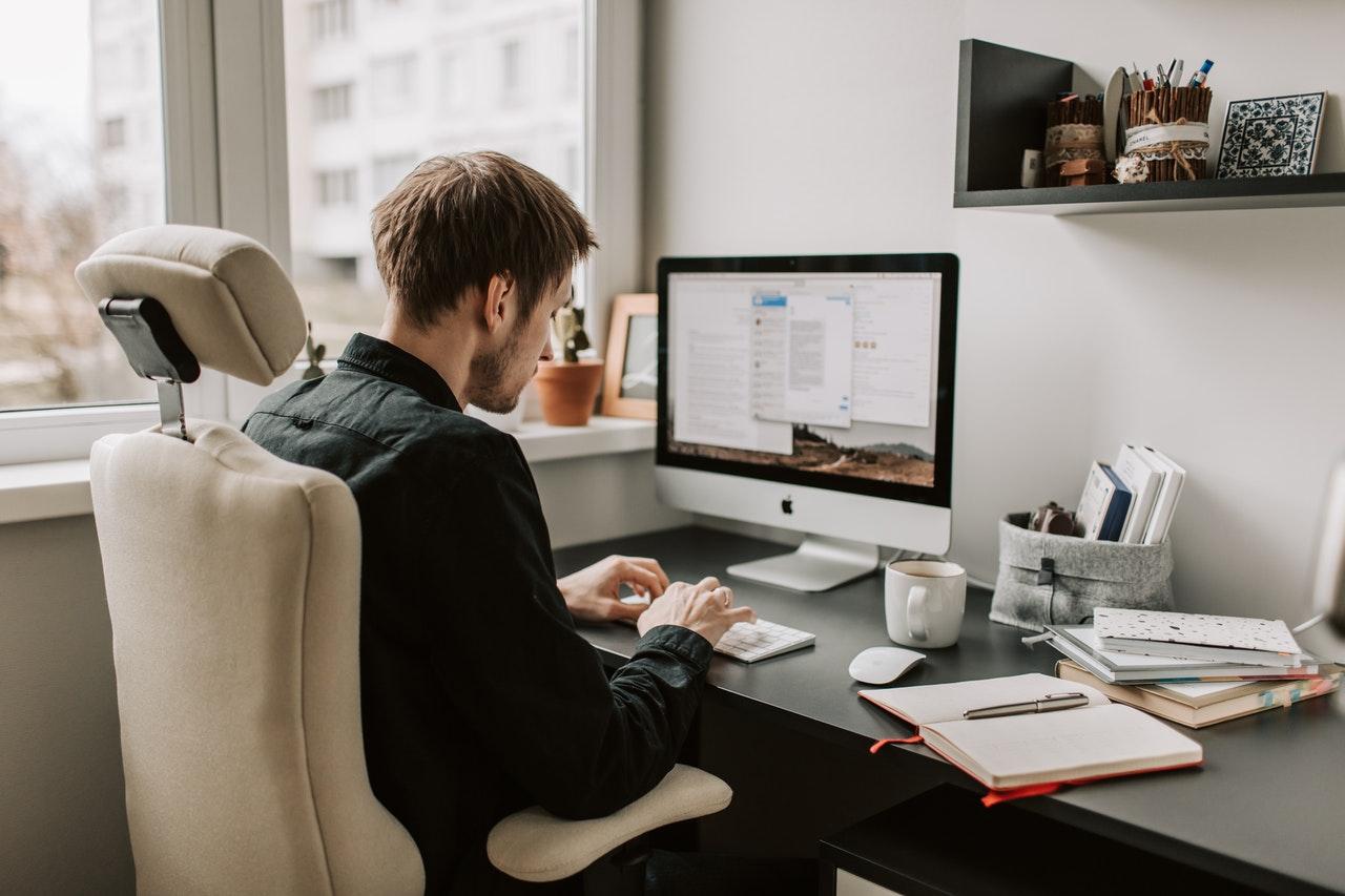 a man using the mac for work